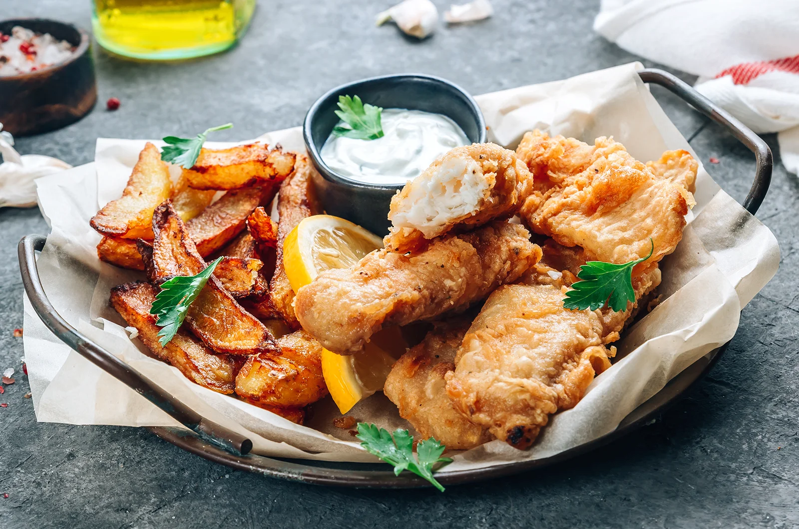 Deep fried golden fish and chips with rance on the side