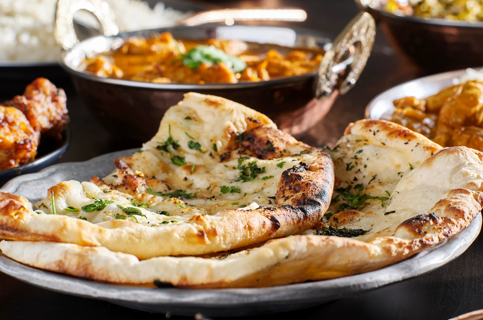 fluffy Tandoori Naan served with other side dishes